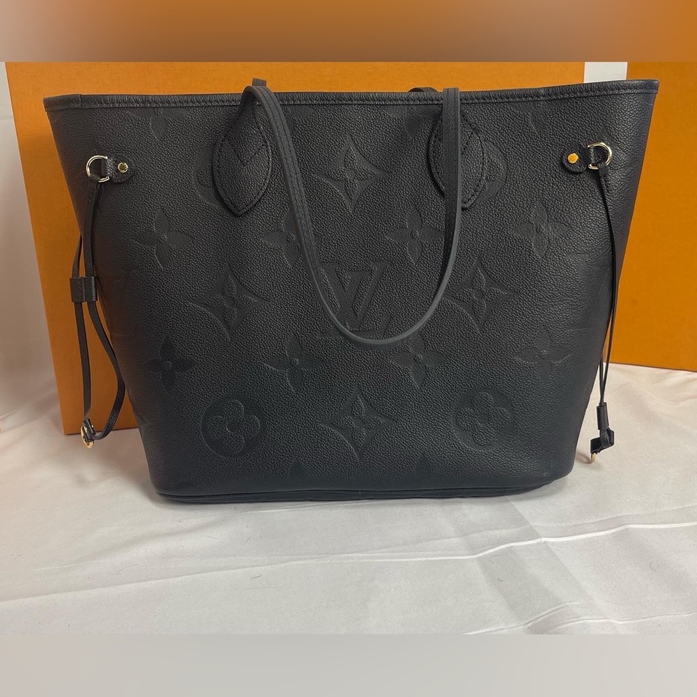 Neverfull MM tote in embossed Monogram Empreinte leather
